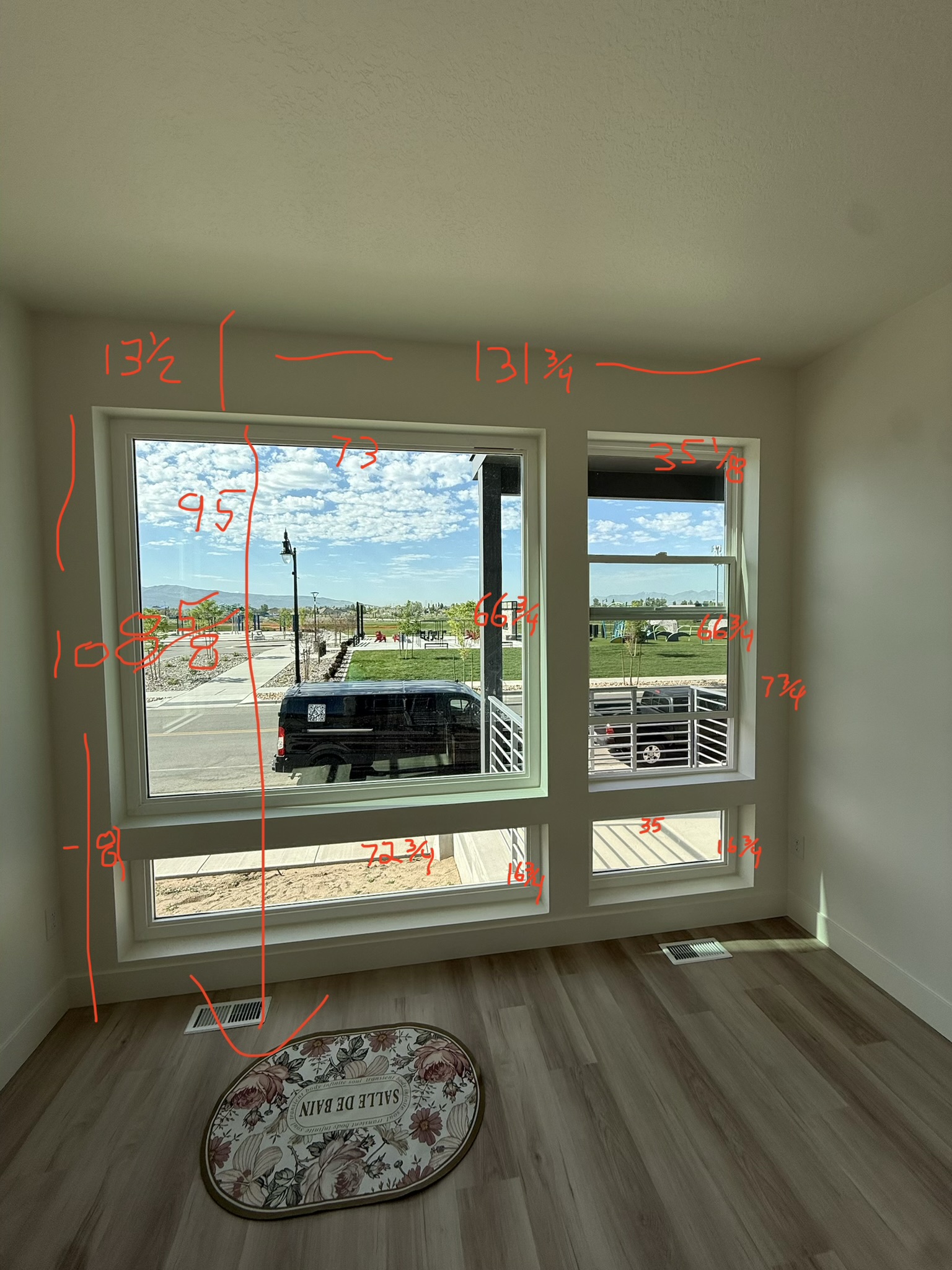Annotated window measurement photo from a real Philly Blinds job site — inside widths, outside span, heights, and trim depths all recorded in red